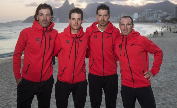 Swiss cycling athletes Fabian Cancellara, Sebastien Reichenbach, Steve Morabito and Michael Albasini, from left, pose in front of Ipanema beach prior to a media conference of the Swiss cycling team pr ...