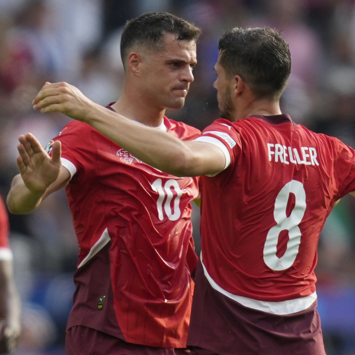 Switzerland's Remo Freuler, right, celebrates with Granit Xhaka after scoring the opening goal during a round of sixteen match between Switzerland and Italy at the Euro 2024 soccer tournament in  ...