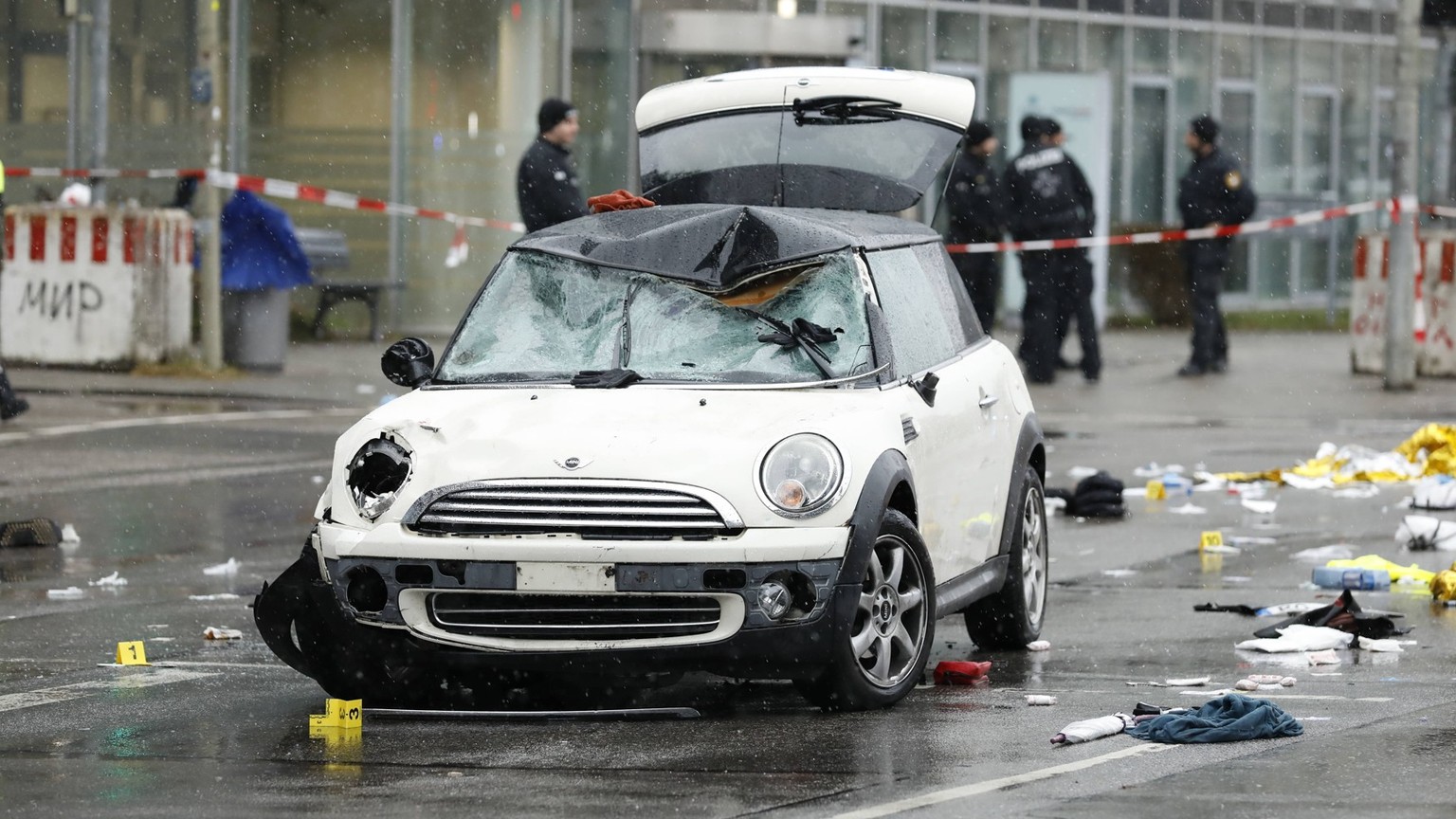 250214 -- BEIJING, Feb. 14, 2025 -- A damaged car is pictured at the site of a car-ramming incident in Munich, Germany, Feb. 13, 2025. At least 28 people, including children, were injured after a car  ...