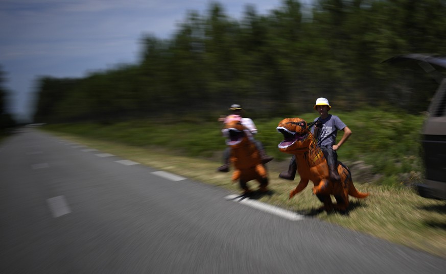 Spectators wait for the riders during the seventh stage of the Tour de France cycling race over 170 kilometers (105.5 miles) with start in Mont-de-Marsan and finish in Bordeaux, France, Friday, July 7 ...