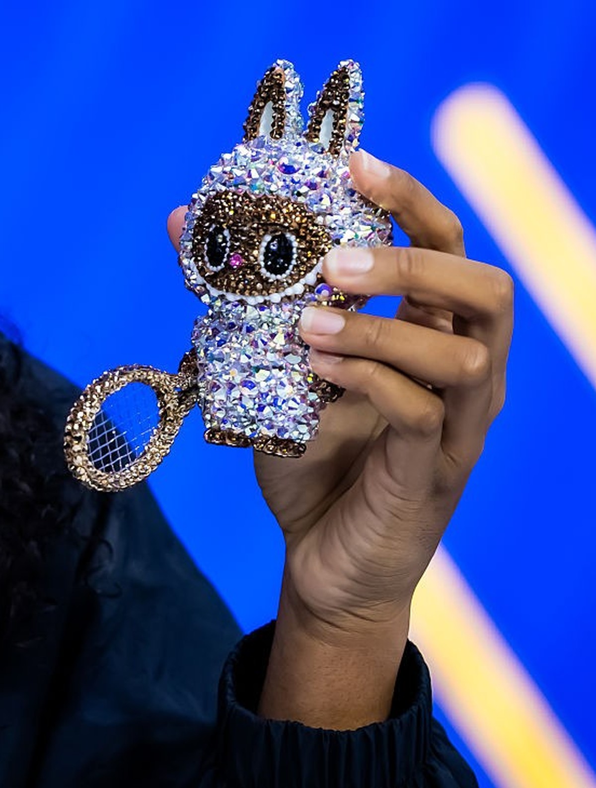 NEW YORK, NEW YORK - SEPTEMBER 01: Naomi Osaka of Japan shows off her Labubu Althea Glitterson while talking to the media after defeating Coco Gauff of the United States in the fourth round on Day 9 o ...