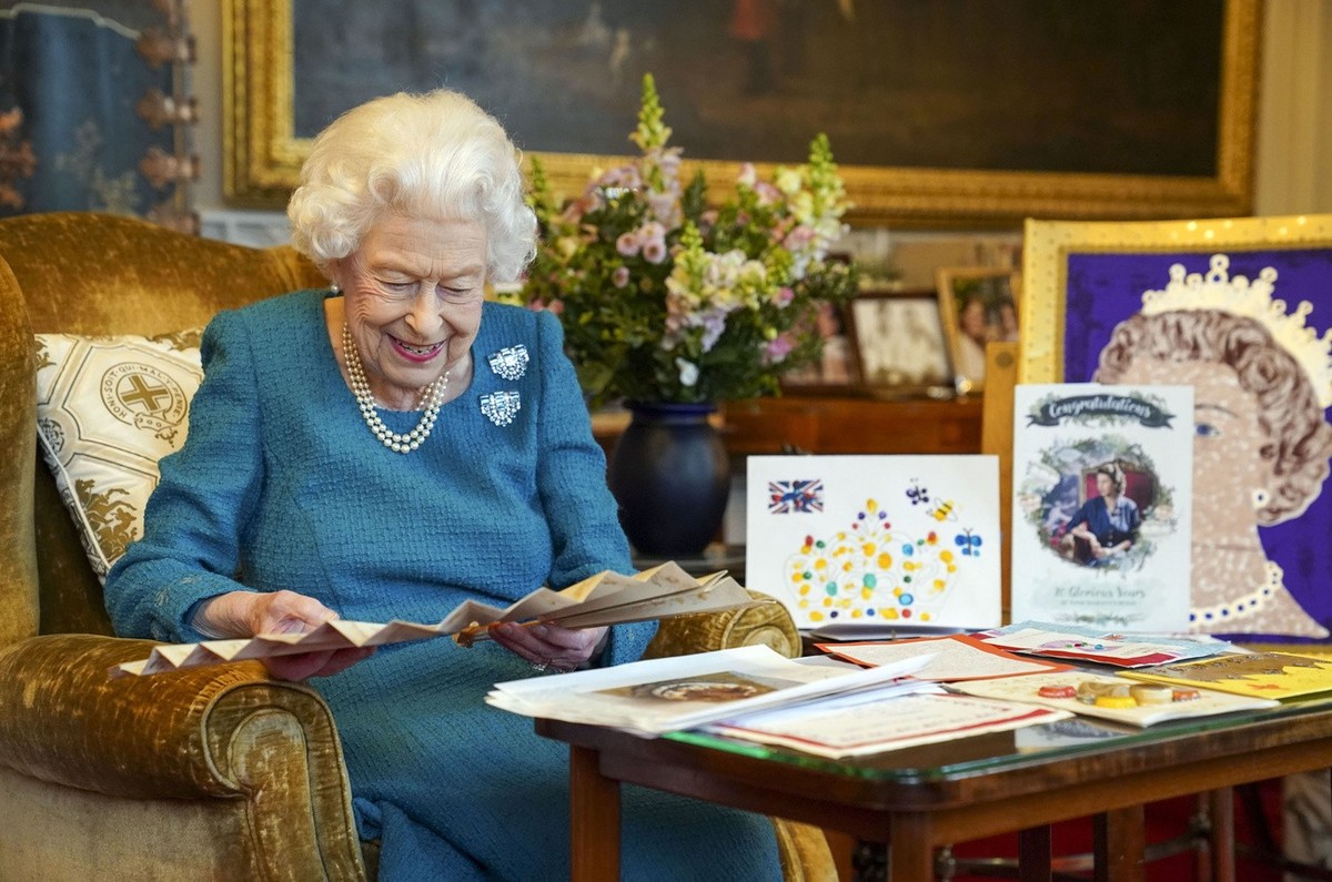 Britain's Queen Elizabeth II looks at a display of memorabilia from her Golden and Platinum Jubilees in the Oak Room at Windsor Castle, Windsor, England, in this undated but recent image that was ...