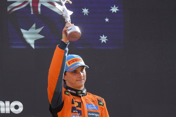 McLaren driver Oscar Piastri of Australia celebrated his third place at the Italian Grand Prix race at the Monza racetrack in Monza, Italy, Sunday, Sept. 7, 2025. (AP Photo/Luca Bruno)
Italy F1 GP Aut ...