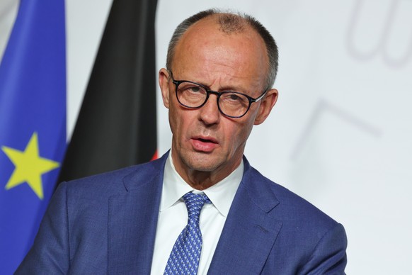 epa12632169 Germany's Chancellor Friedrich Merz addresses a press conference upon the signing of the declaration on deploying post-ceasefire force in Ukraine during the Coalition of the Willing s ...