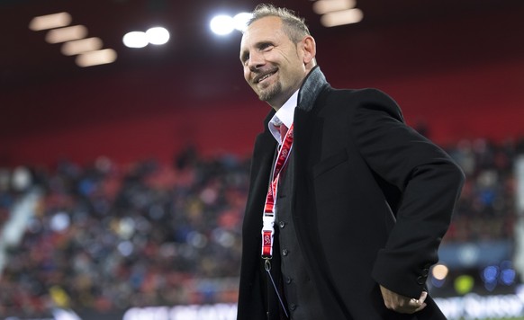 Switzerland's head coach Mauro Lustrinelli smiles before a qualification soccer match for the European Under 21 Championship between Switzerland and France at the Stadium Stade de la Maladiere, i ...