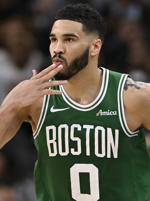 Boston Celtics forward Jayson Tatum celebrates a three-point basket during the second half of an NBA basketball game against the San Antonio Spurs, Saturday, March 29, 2025, in San Antonio. (AP Photo/ ...