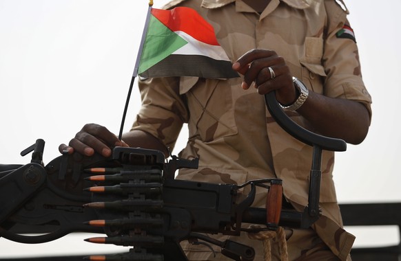 FILE - In this June 22, 2019 file photo, a Sudanese soldier from the Rapid Support Forces or RSF, led by Gen. Mohammed Hamdan Dagalo, stands on his vehicle during a military-backed tribe&#039;s rally, ...