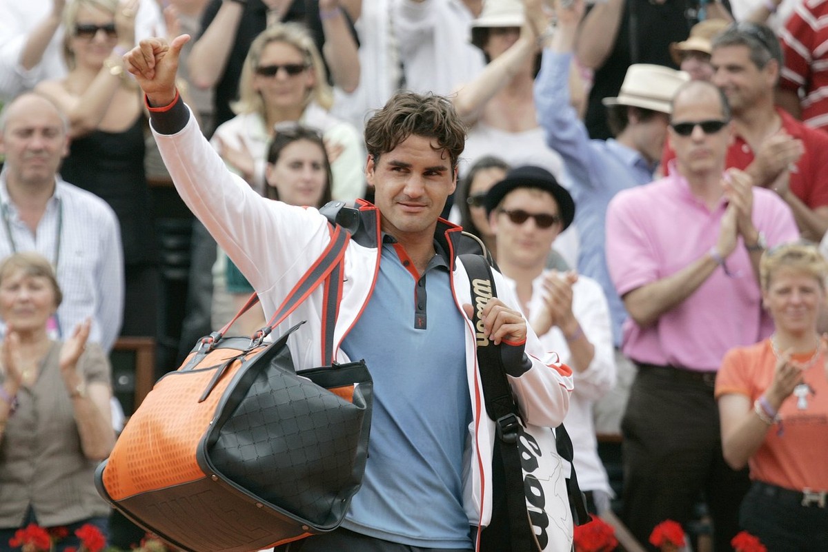 Switzerland's Roger Federer gestures after defeating Germany's Tommy Haas during their fourth round match of the French Open tennis tournament at the Roland Garros stadium in Paris, Monday J ...