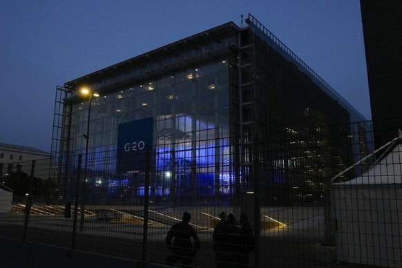 Italian police patrol in front of La Nuvola (the cloud) convention center where the G20 summit is scheduled to take place in Rome, Thursday, Oct. 28, 2021. A Group of 20 summit scheduled for this week ...