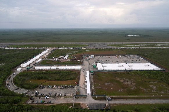FILE - Work progresses on a new migrant detention facility dubbed "Alligator Alcatraz," at Dade-Collier Training and Transition facility in the Florida Everglades, on July 4, 2025, in Ochope ...
