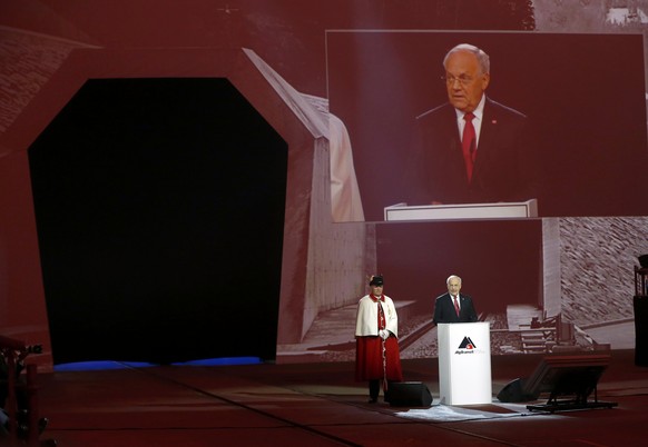 Swiss President Johann Schneider-Ammann addresses guests during the opening ceremony of the NEAT Gotthard Base Tunnel, the world&#039;s longest and deepest rail tunnel, near the town of Erstfeld, Swit ...