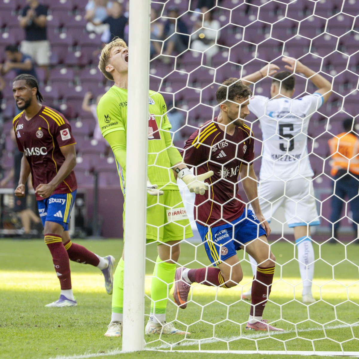 The goalkeeper Pascal Loretz (FCL), 2nd left, reacts between Florian Aye (SFC), left, Miroslav Stevanovic (SFC), 2nd right, and Stefan Knezevic (FCL), right, after conceding the second goal, during th ...
