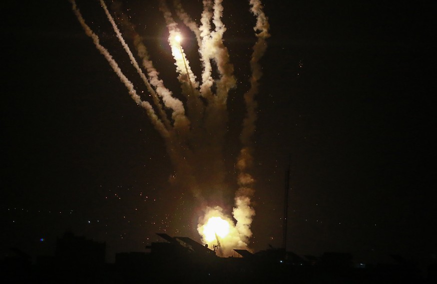 epa10108037 Rockets are fired by fighters from Al-Quds Brigades, the armed wing of the Palestinian Islamic Jihad, in east Gaza City, 05 August 2022. Palestinian militants in Gaza fired rockets targeti ...