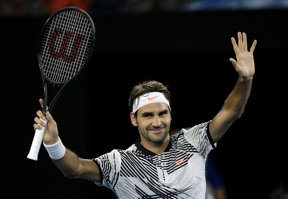 Switzerland&#039;s Roger Federer celebrates after defeating Austria&#039;s Jurgen Melzer in their first round match at the Australian Open tennis championships in Melbourne, Australia, Monday, Jan. 16 ...