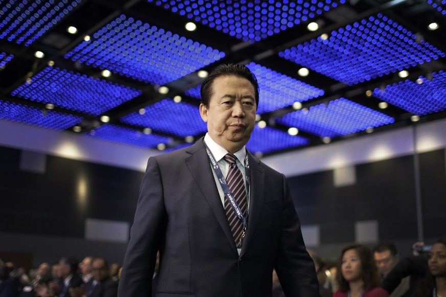 Interpol President, Meng Hongwei, walks towards the stage to deliver his opening address at the Interpol World congress on Tuesday, July 4, 2017, in Singapore. (AP Photo/Wong Maye-E)