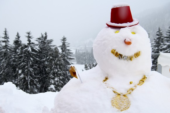 A snowman is pictured on the roof of the Congress Centre on the eve of the 48th Annual Meeting of the World Economic Forum, WEF, in Davos, Switzerland, Monday, January 22, 2018. The meeting brings tog ...