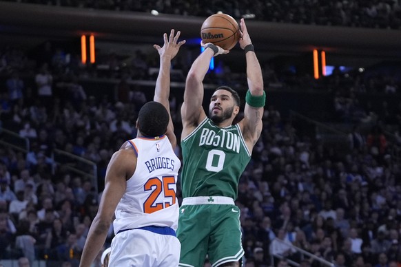 Boston Celtics&#039; Jayson Tatum, right, shoots over New York Knicks&#039; Mikal Bridges, left, during the second half of Game 3 of an NBA basketball second-round playoff series, Saturday, May 10, 20 ...