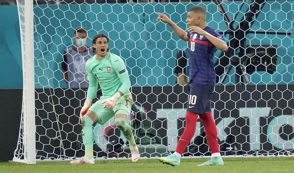 Switzerland&#039;s goalkeeper Yann Sommer reacts after France&#039;s Kylian Mbappe failed to score by penalty at the Euro 2020 soccer championship round of 16 match between France and Switzerland at t ...