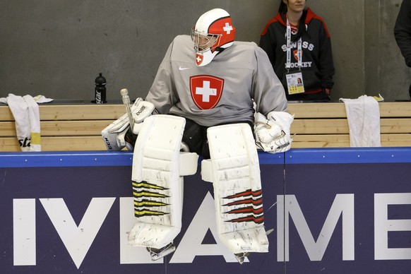 Switzerland&#039;s goaltender Leonardo Genoni sits on the board rink, during a training session of the IIHF 2018 World Championship at the practice arena of the Royal Arena, in Copenhagen, Denmark, Mo ...