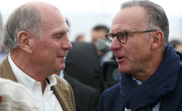 Former Bayern Munich President Uli Hoeness (L) speaks to Karl-Heinz Rummenigge, CEO of Bayern Munich during the official foundation stone laying ceremony of Bayern Munich&#039;s youth training centre  ...