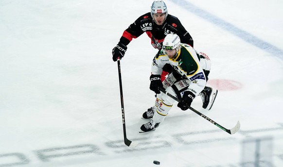 Basel, Switzerland, February 28th 2025: Patrick Obrist 13 Olten battles for the puck during the Sky Swiss League Playoff Semi-Final Ice hockey, Eishockey match between EHC Basel and EHC Olten at St. J ...