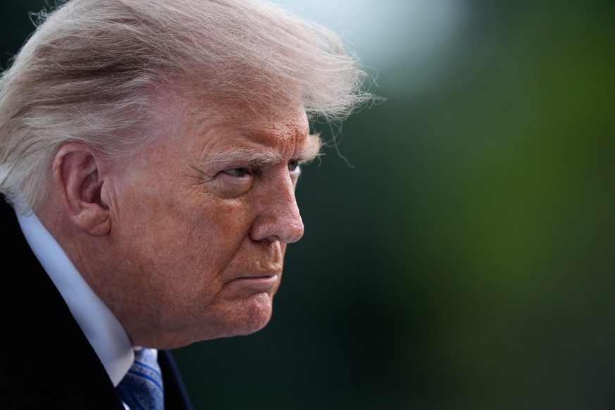 President Donald Trump talks with reporters on the South Lawn Wednesday, Sept. 23, 2026, in Washington, after greeting China's President Xi Jinping at Joint Base Andrews. (AP Photo/Manuel Balce C ...
