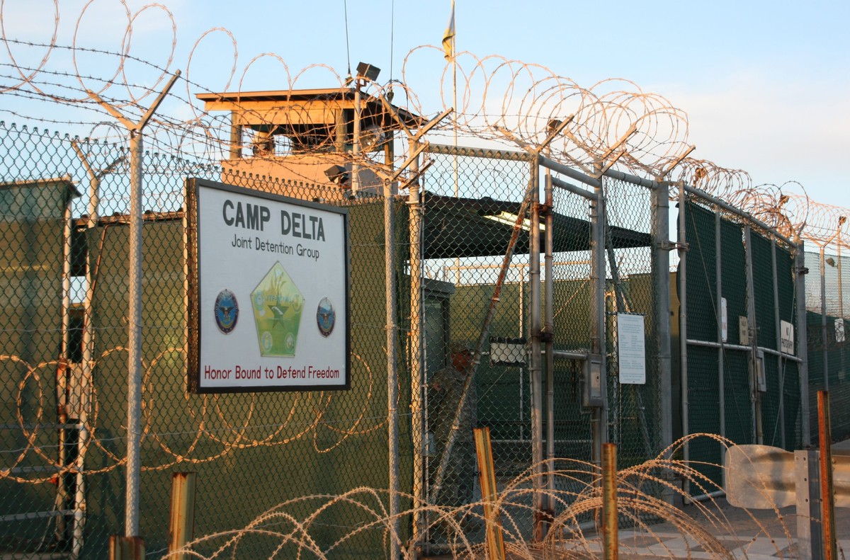 FILE - This Oct. 24, 2010, file photo shows the entrance to Camp Delta at Guantanamo Bay. Six men long held at Guantanamo Bay arrived Saturday, June 13, 2015, in Oman, the first movement of detainees  ...