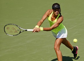 Vitalia Diatchenko, of Russia, returns a shot to Timea Bacsinszky, of Switzerland, during the first round of the U.S. Open tennis tournament, Tuesday, Aug. 30, 2016, in New York. (AP Photo/Andres Kuda ...