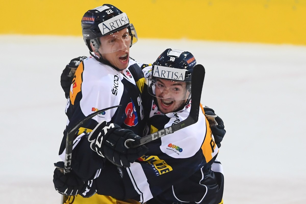 Ambri's player Diego Kostner , left, celebratsthe 1-0 goal, with Ambri's player Noele Trisconi scorer , right, during the regular season game of the National League Swiss Championship 2018/1 ...