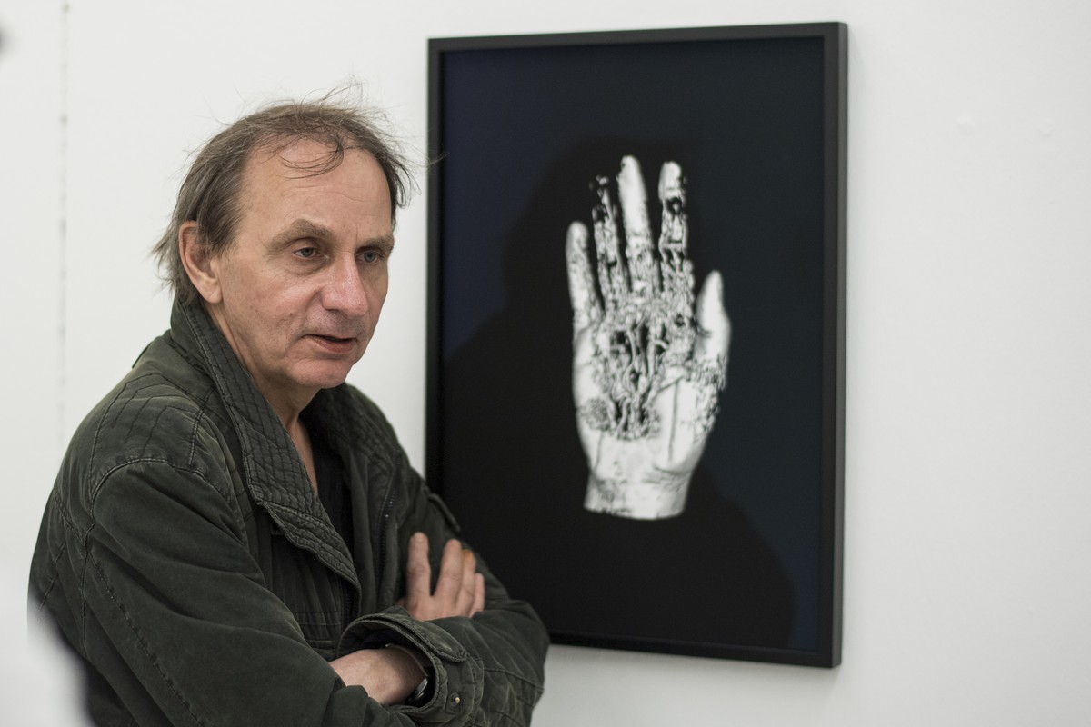 French Artist Michel Houellebecq watches his artwork "Matiere from the series Michel Houellebecq OK?", at the Helmhaus during the press and preview day of the european biennale of contempora ...