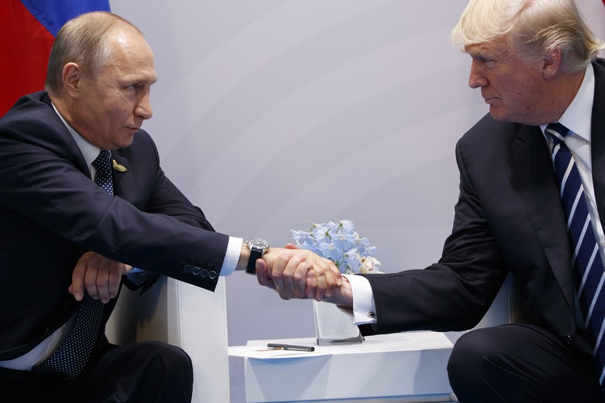 President Donald Trump shakes hands with Russian President Vladimir Putin at the G20 Summit, Friday, July 7, 2017, in Hamburg. (AP Photo/Evan Vucci)