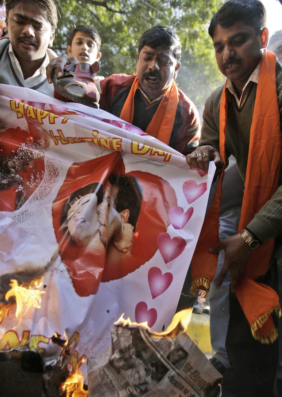 Members of the Hindu nationalist Shiv Sena party burn Valentine's Day posters, in New Delhi, India, Wednesday, Feb. 13, 2008. The protesters lamented the growing influence of western ideas on Ind ...