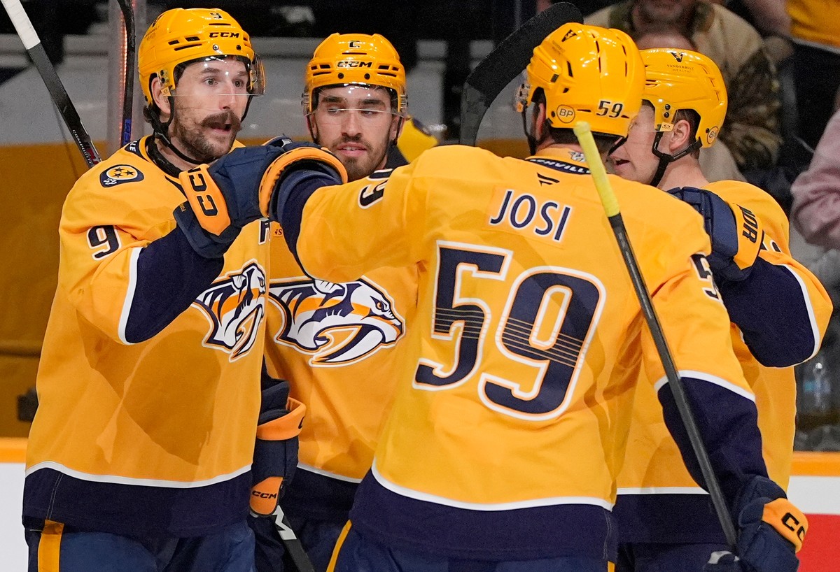 Nashville Predators left wing Filip Forsberg (9) celebrates his goal with teammates defenseman Adam Wilsby (2) and defenseman Roman Josi (59) during the second period of an NHL hockey game Thursday, O ...