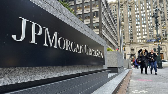 FILE - Pedestrians approach JP Morgan Chase headquarters, Wednesday, Dec. 29, 2023, in New York. (AP Photo/Peter Morgan, File)