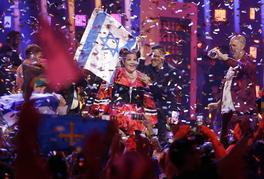 Netta from Israel celebrates after winning the Eurovision Song Contest grand final in Lisbon, Portugal, Saturday, May 12, 2018. (AP Photo/Armando Franca)