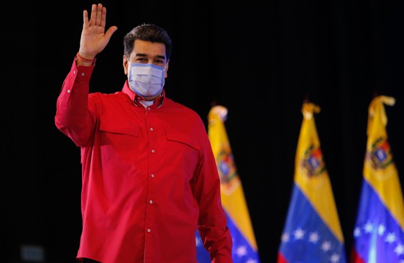epa08910664 A handout photo made available by the Miraflores press shows president of Venezuela, Nicolas Maduro, during a ceremony with the governors and pro-government mayors, in Caracas, Venezuela,  ...