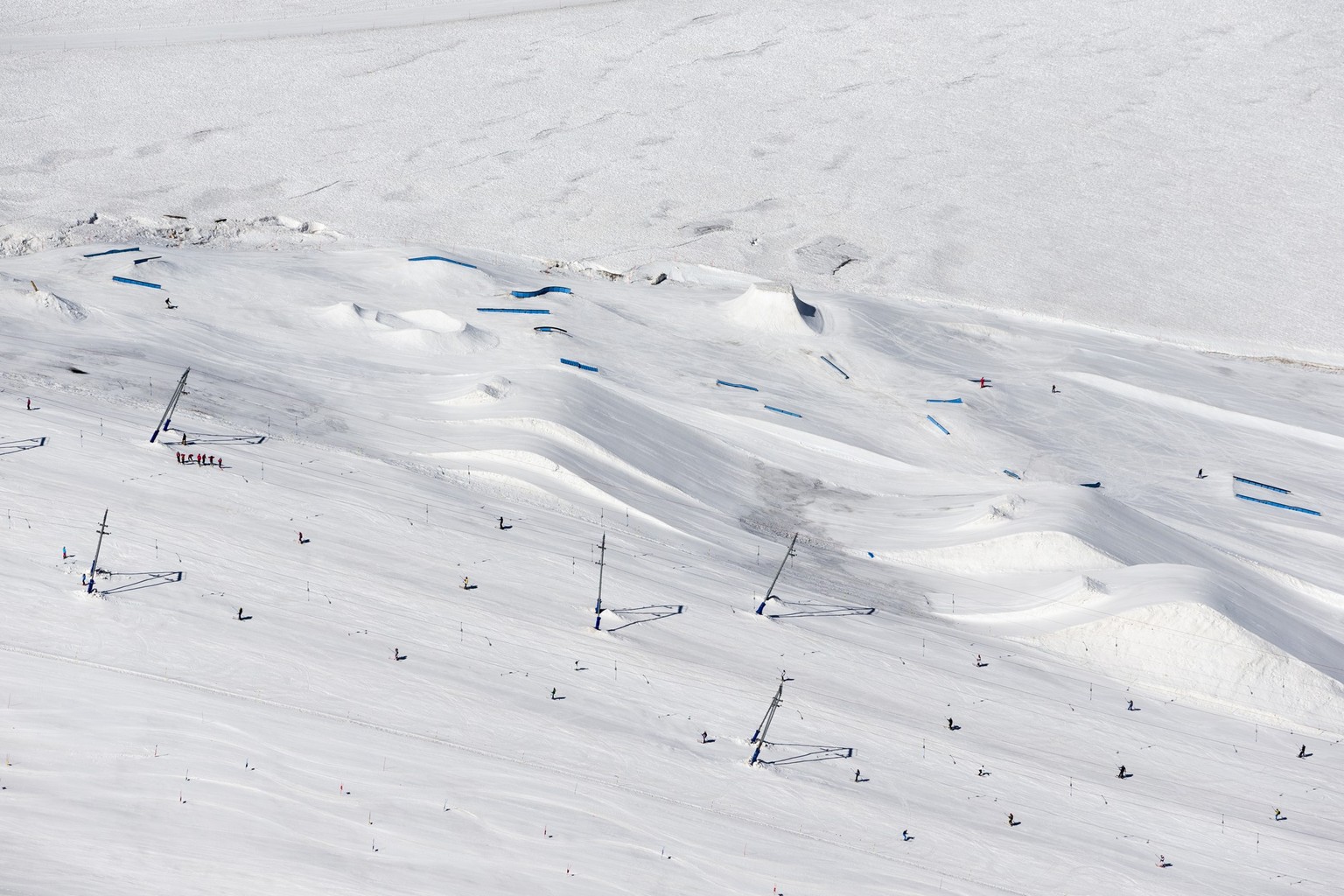 View from the Klein Matterhorn station towards the Snowpark Zermatt on the Theodul glacier on Thursday, August 2, 2018, in Zermatt, Valais, Switzerland. This snowpark in the skiing resort Matterhorn G ...