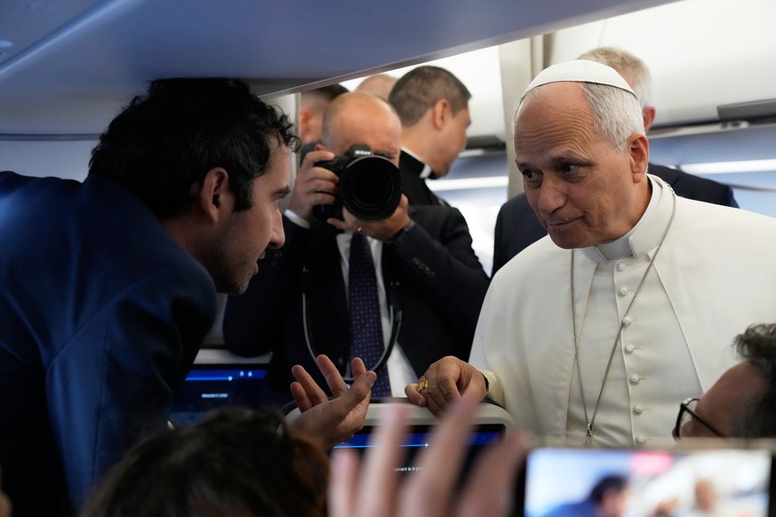 Pope Leo XIV talks to journalists aboard the papal flight from Rome to Paris, Friday, Sept. 25, 2026, during his apostolic journey to France. (AP Photo/Gregorio Borgia, Pool)
Pope Leo XIV