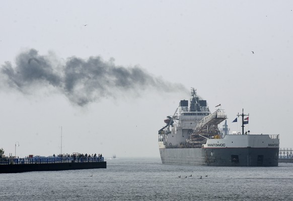 A haze from Canadian wildfires lingers over Lake Michigan as the freighter Manitowoc docks Wednesday, June 28, 2023, in St. Joseph, Mich.(Don Campbell/The Herald-Palladium via AP)
