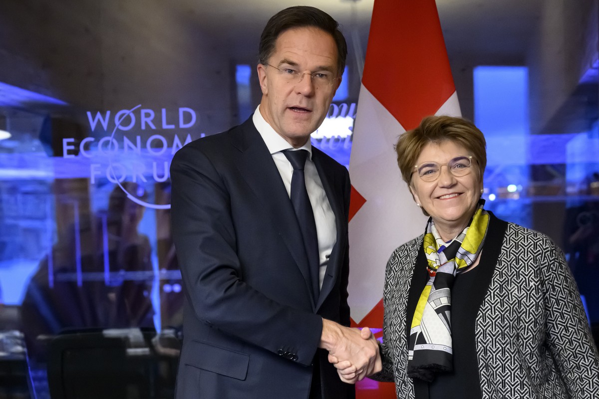 Switzerland's Defense Minister Federal Councillor Viola Amherd, right, shakes hands with NATO Secretary General Mark Rutte, left, prior to a bilateral meeting on the sideline of the 55th annual m ...