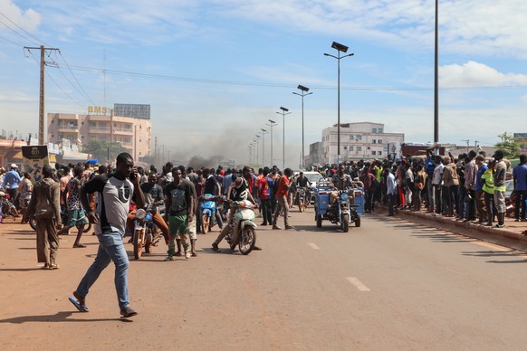 epa11609794 Local residents react near the site of an attack in Bamako, Mali, 17 September 2024. According to the General Staff of the Armed Forces, a group of terrorists attempted to infiltrate the F ...