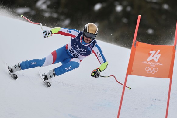 France's Nils Alphand speeds down the course during an alpine ski, men's super-G race, at the 2026 Winter Olympics, in Bormio, Italy, Wednesday, Feb. 11, 2026. (AP Photo/Gabriele Facciotti)
 ...