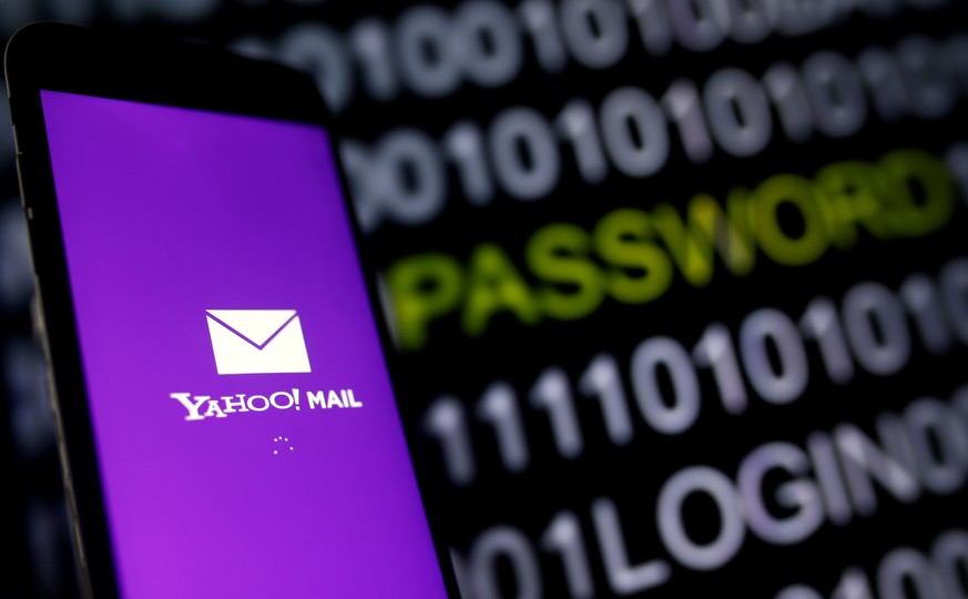 Yahoo Mail logo is displayed on a smartphone&#039;s screen in front of code in this illustration picture, October 6, 2016. REUTERS/Dado Ruvic/Illustration/File Photo