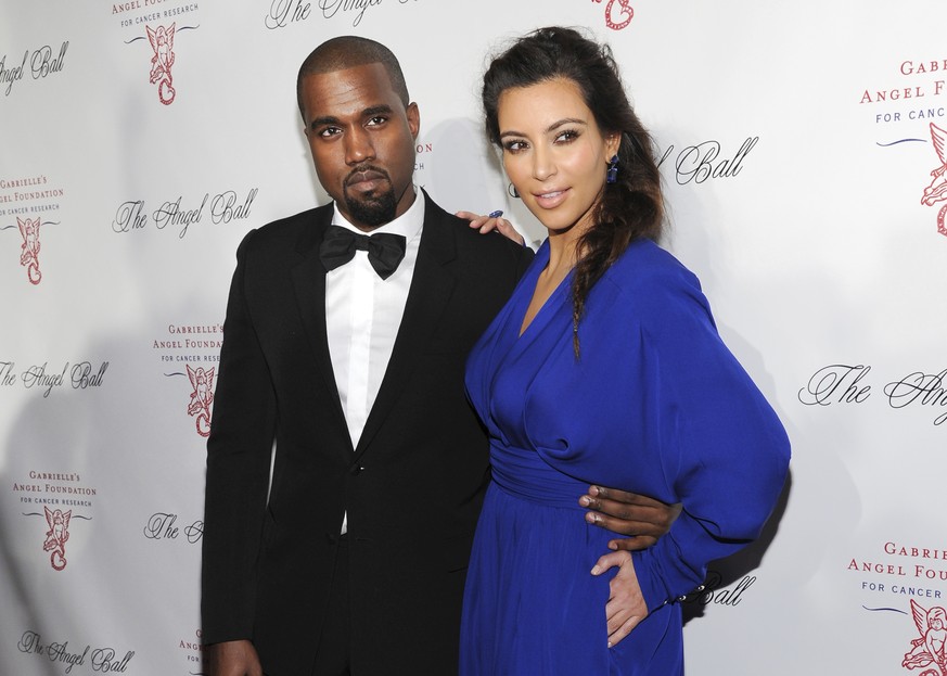 FILE - This Oct. 22, 2012 file photo shows singer Kanye West, left, and TV personality Kim Kardashian at Gabrielle&#039;s Angel Foundation 2012 Angel Ball in New York. The couple married in 2014 and h ...