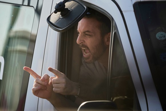 David Cunio, an Israeli hostage released from the Gaza Strip gestures from a minibus at the Sheba Medical Center in Ramat Gan, Israel, Monday, Oct. 13, 2025. (AP Photo/Leo Correa)
Israel Palestinians  ...