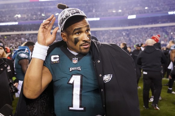Philadelphia Eagles quarterback Jalen Hurts walks on the field after the NFC Championship NFL football game between the Philadelphia Eagles and the San Francisco 49ers on Sunday, Jan. 29, 2023, in Phi ...