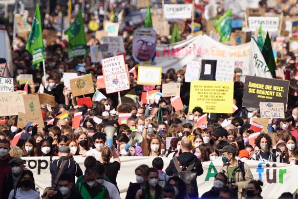 epa09848706 Demonstrators protest during a rally of Fridays for Future in Berlin, Germany, 25 March 2022. The 10th global strike of Fridays for Future takes place under the motto &#039;#PeopleNotProfi ...