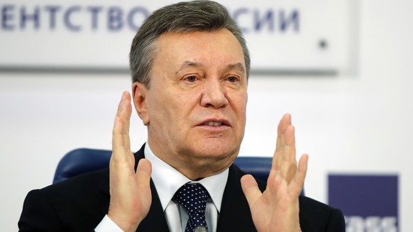 FILE - In this March 2, 2018 file photo, former Ukraine President Viktor Yanukovych gestures as he speaks at a news conference in Moscow. A court in the Ukrainian capital Kiev on Thursday Jan. 24, 201 ...