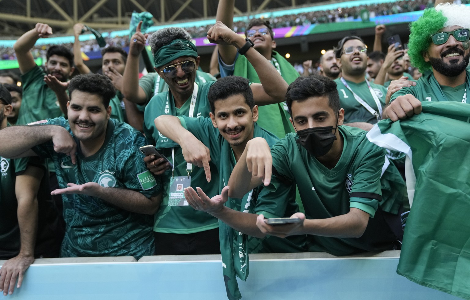 Saudi Arabia&#039;s fans celebrate their victory after the World Cup group C soccer match between Argentina and Saudi Arabia at the Lusail Stadium in Lusail, Qatar, Tuesday, Nov. 22, 2022. (AP Photo/J ...