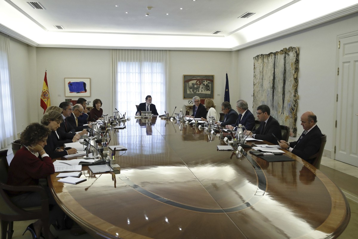 Spain's Prime Minister Mariano Rajoy presides over a Cabinet meeting in Madrid, Spain, Saturday, Oct. 21, 2017. The meeting is expected to outline the measures to take over control of the northea ...